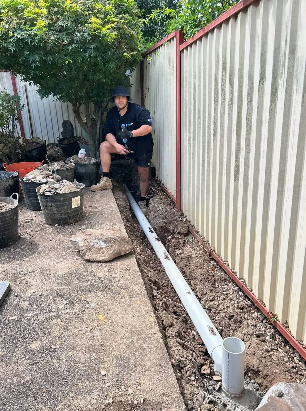 New sewer pipe laid along a fence line