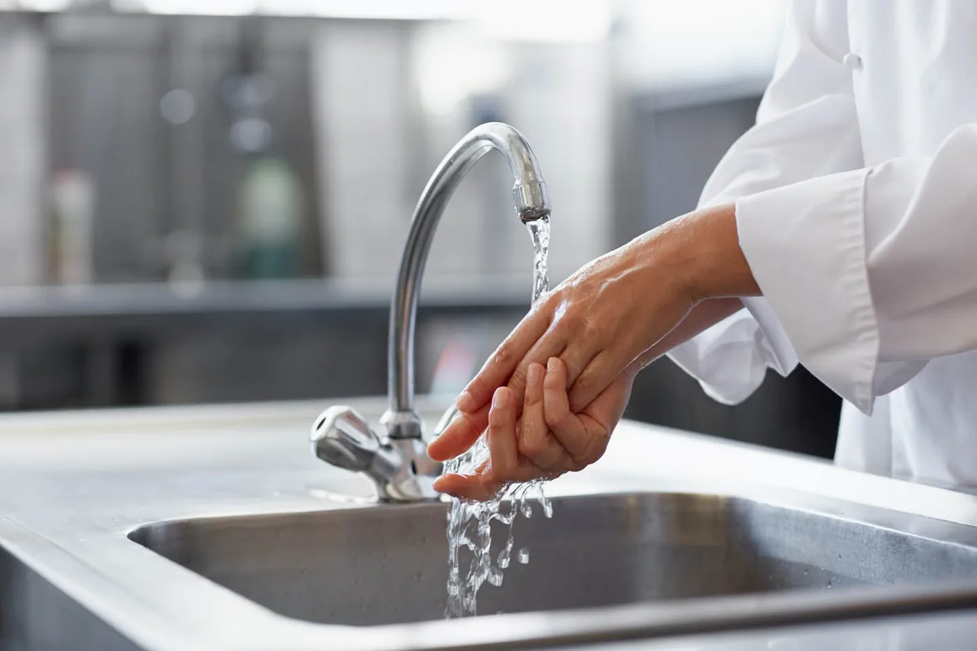 Rinsing at a commercial kitchen sink